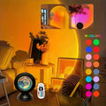 Sunset projection night light with remote projecting an orange sunset glow on a wall
