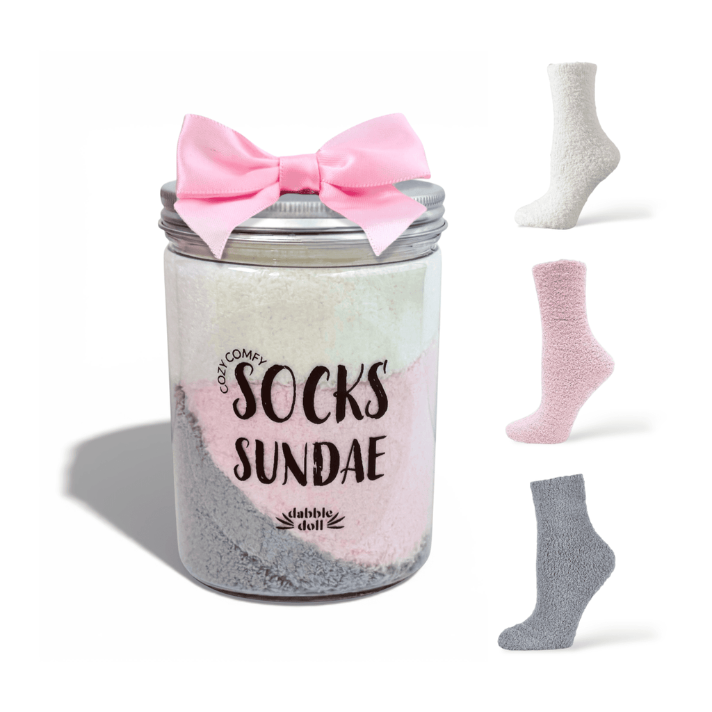 Three pairs of cozy socks in a sundae jar with a bow